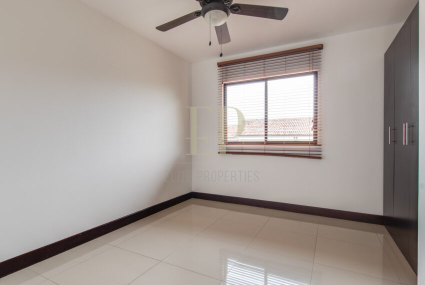 Two story home with green, private patio