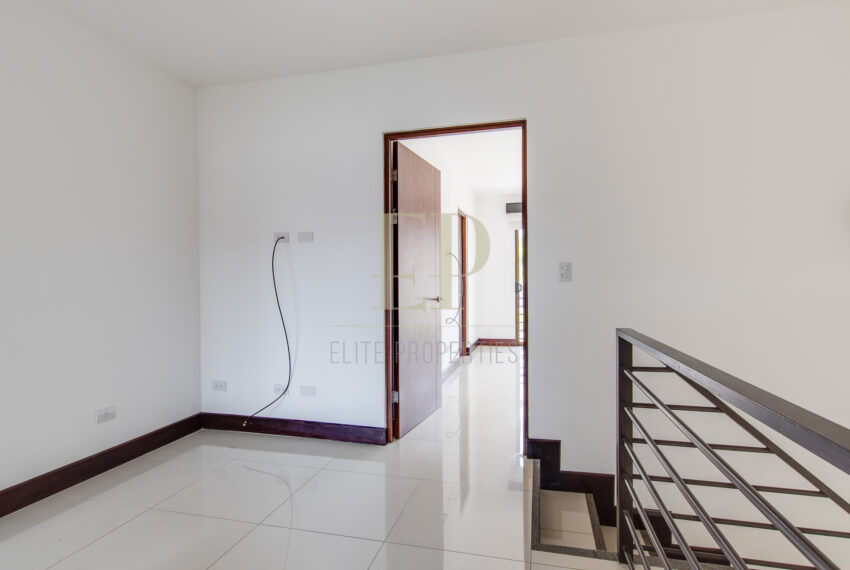 Two story home with green, private patio
